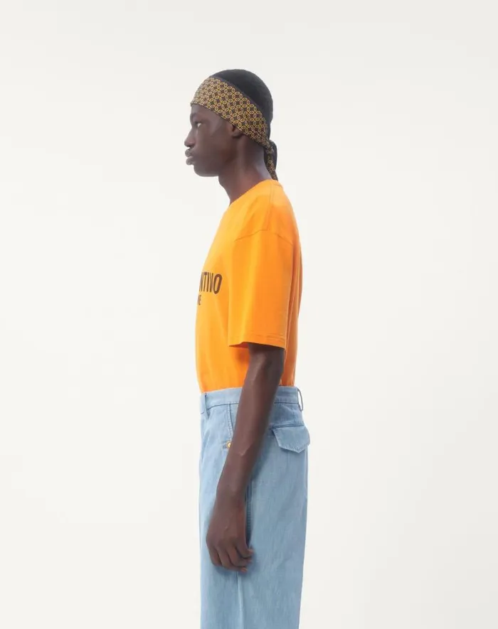 Valentino Tshirts And Sweatshirts Man Cotton Tshirt With Chez Valentino Print For Man In Orange Orange Valentino Tshirts And Sweatshirts Man Cotton Tshirt With Chez Valentino Print For Man In Orange Orange