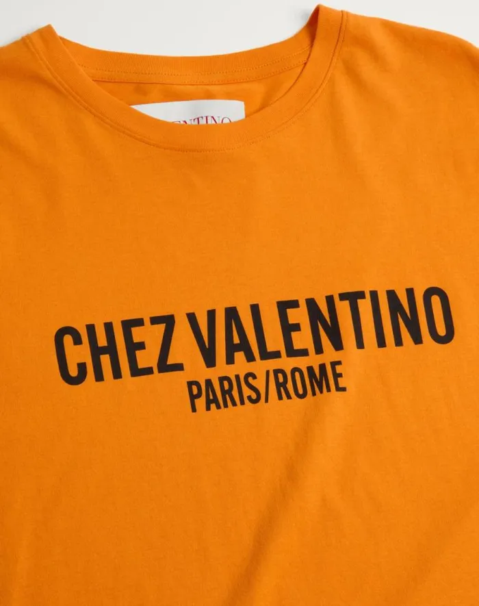 Valentino Tshirts And Sweatshirts Man Cotton Tshirt With Chez Valentino Print For Man In Orange Orange Valentino Tshirts And Sweatshirts Man Cotton Tshirt With Chez Valentino Print For Man In Orange Orange